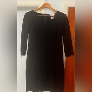 Kenar 3/4 sleeve dress. Size 6. Black scuba material, v neck, form fitting.